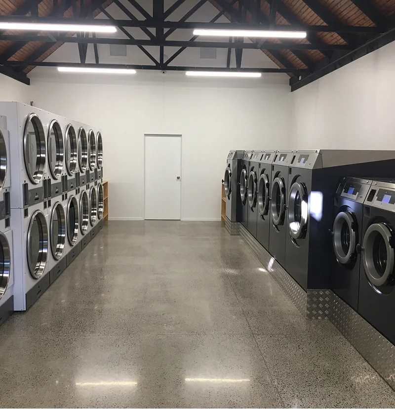 Washers and dryers at a Palmerston North laundromat run by The Laundry Room