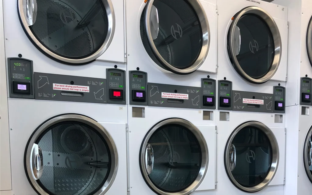 Close-up of stacked dryers at The Laundry Room Raumati Beach, Kāpiti