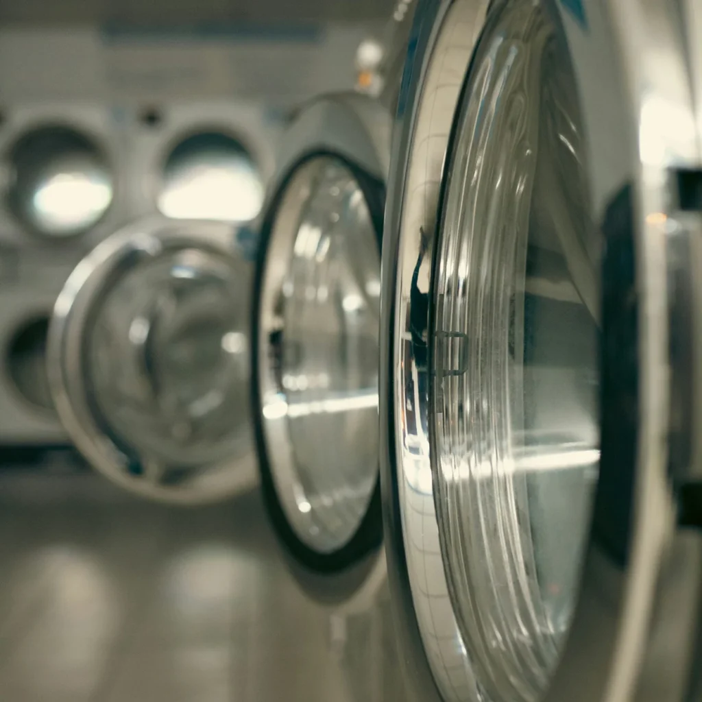 Open door of a commercial front-loading washing machine